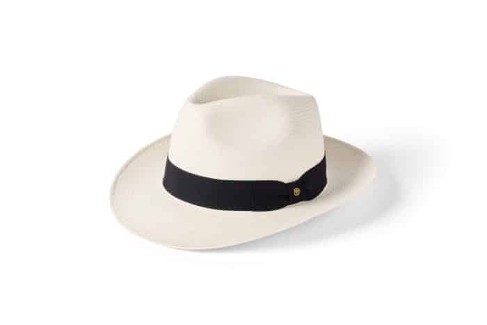 The Failsworth Snap Brim Panama hat is shown in white with a wide brim and a black crown band, set against a plain white background.