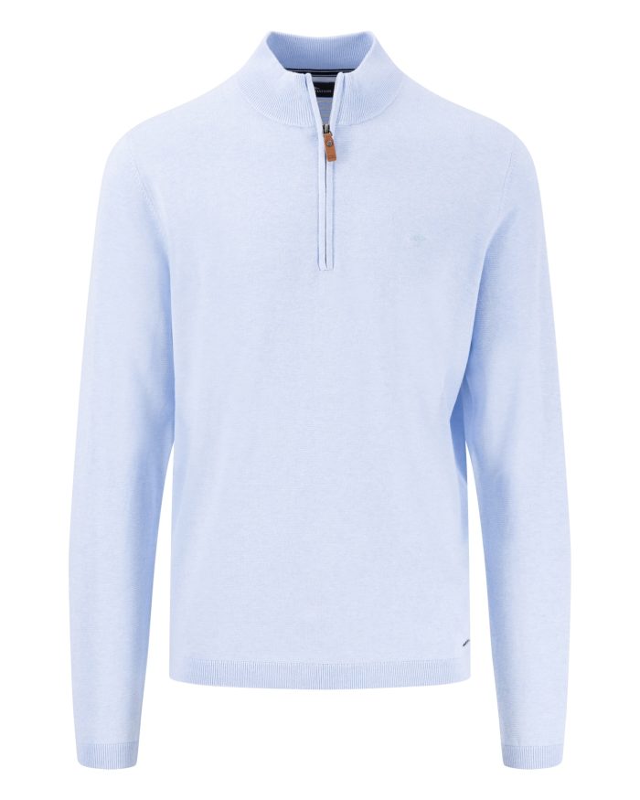 A light blue long-sleeve sweater with a half-zip design and a small brown zipper pull. The sweater features ribbed cuffs and hem, and a subtle logo on the left chest area.