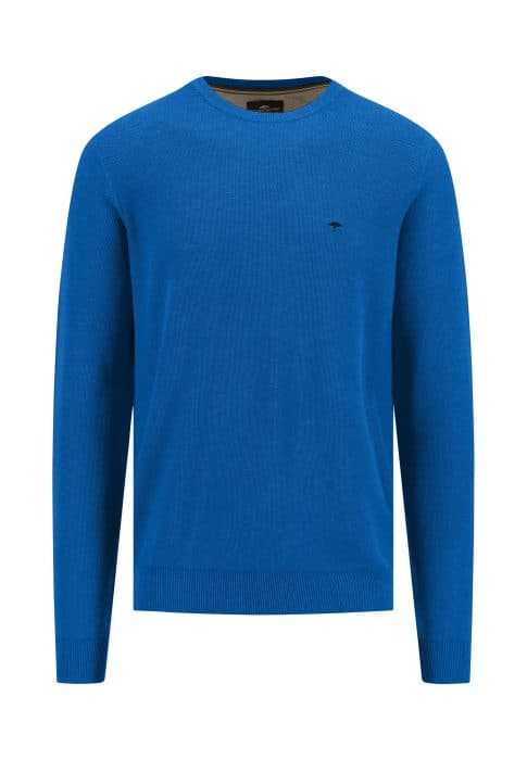 Blue crewneck sweater with long sleeves and a small embroidered logo on the left chest. The fabric appears to be smooth, and the cuffs and hem are ribbed. The neckline has a contrasting inner trim.