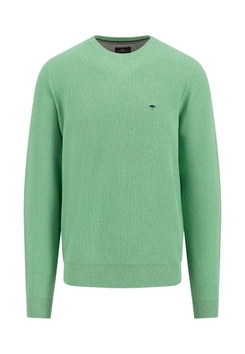 A green knit sweater with a crew neck and ribbed cuffs and hem. It features a small, dark emblem on the left chest area. The sweater is displayed against a white background.