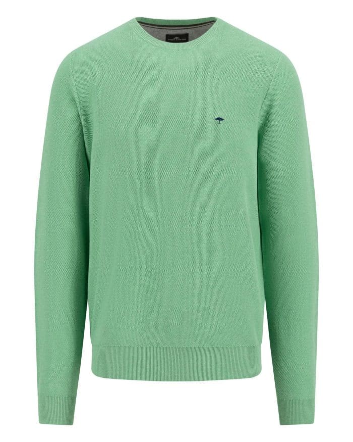 A green knit sweater with a crew neck and ribbed cuffs and hem. It features a small, dark emblem on the left chest area. The sweater is displayed against a white background.