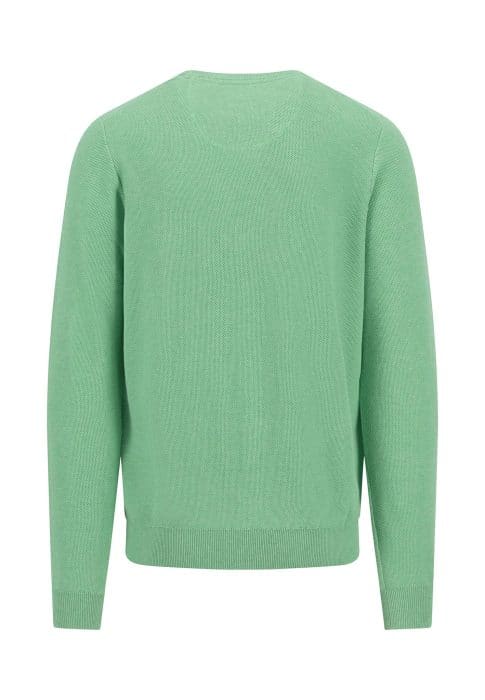 Green sweater seen from the back, with long sleeves and a round neckline. The fabric appears smooth, and the color is light green. The design is simple and unadorned.