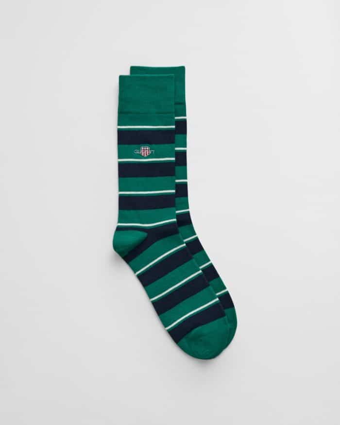 Pair of green and navy striped socks with a faintly visible small embroidered logo near the top. The stripes are evenly spaced, alternating between two shades of green and navy blue, and the socks are neatly laid out on a plain white background.