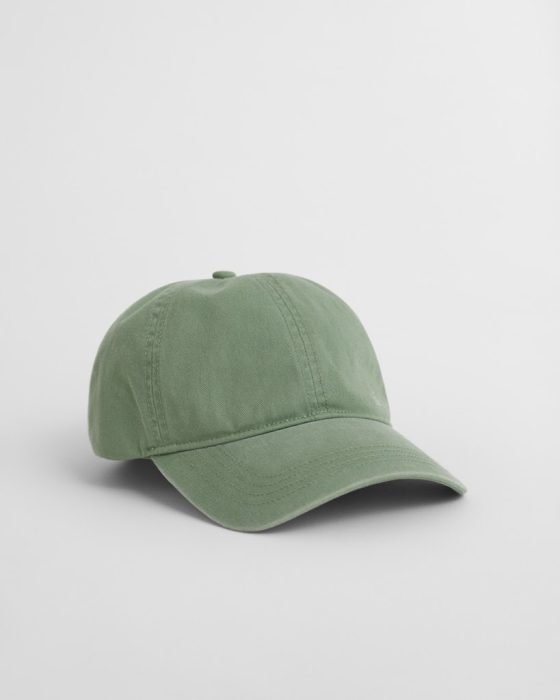 A green baseball cap made of fabric is placed on a plain white background. The cap has a curved brim and visible stitching details.