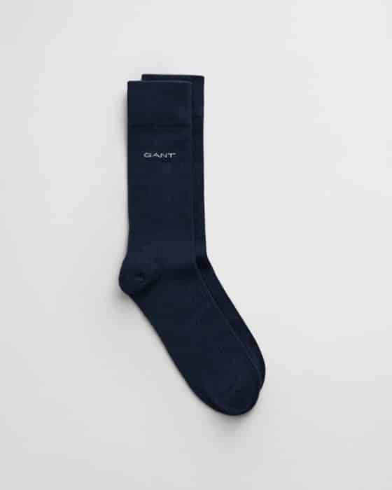 A pair of dark blue socks with the brand name GANT embroidered in white near the top. The socks have a ribbed texture and are displayed against a plain white background.