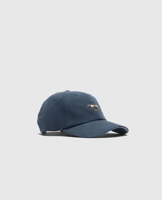 A navy blue baseball cap with a curved brim and adjustable strap. The front features a small embroidered design of a running horse in gold and white. The cap sits against a plain light gray background.