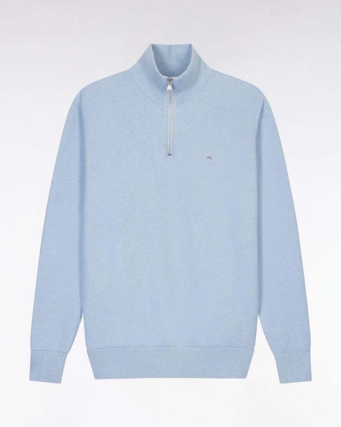 Light blue quarter-zip pullover sweater with a high collar and small logo on the chest, shown against a plain white background.