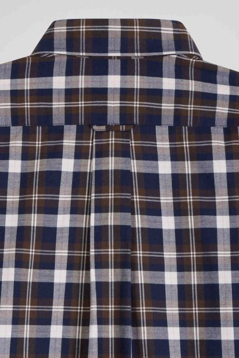 Close-up of a plaid shirt with a pattern of navy blue, brown, and white lines. The image shows the back of the shirt, highlighting the collar and a central pleat detail.