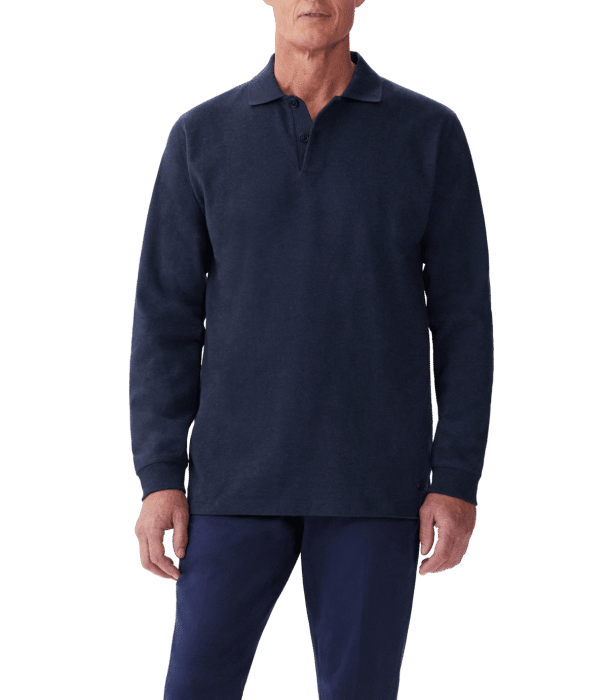 A man wearing a long-sleeve, dark navy collared shirt and matching navy pants, standing against a plain background. His face is not fully visible.
