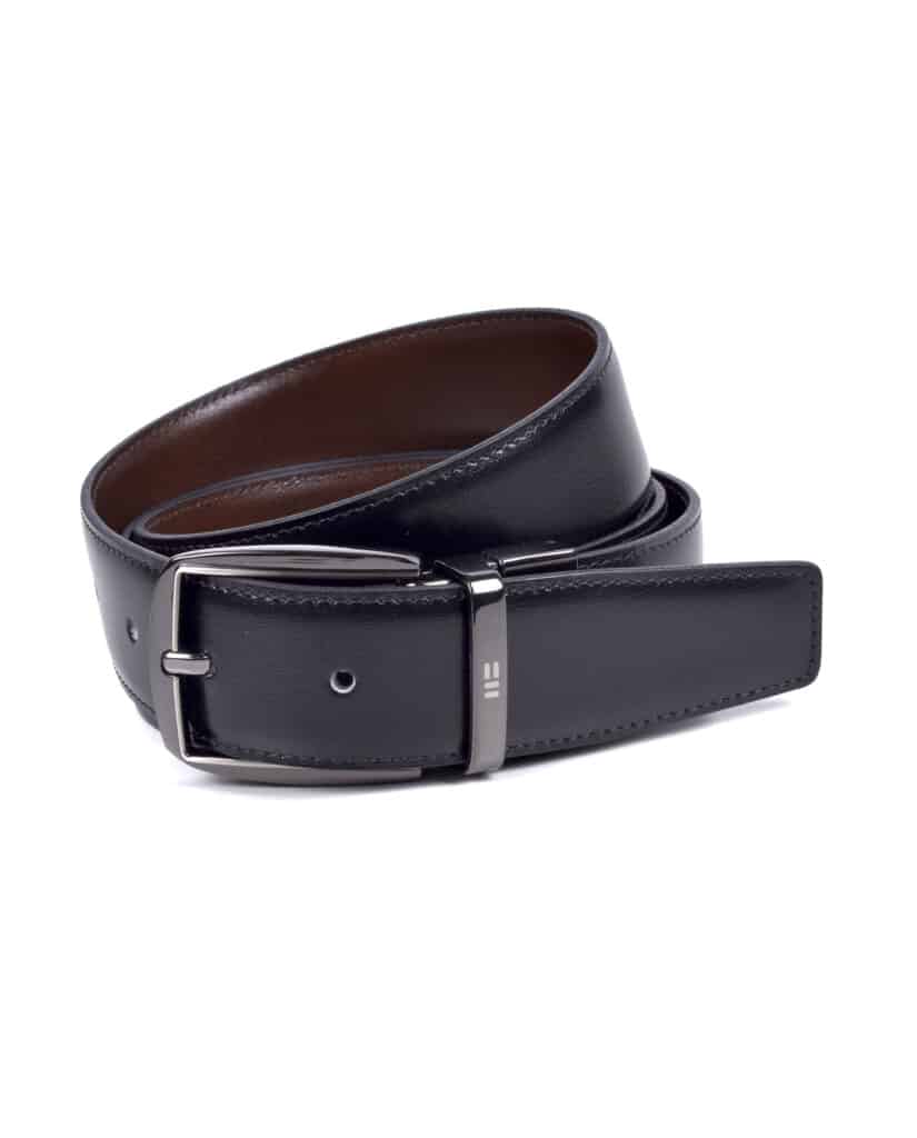 A coiled black leather belt with a silver buckle, displayed on a white background. The belt has smooth stitching and a polished finish, with the inner side appearing brown.