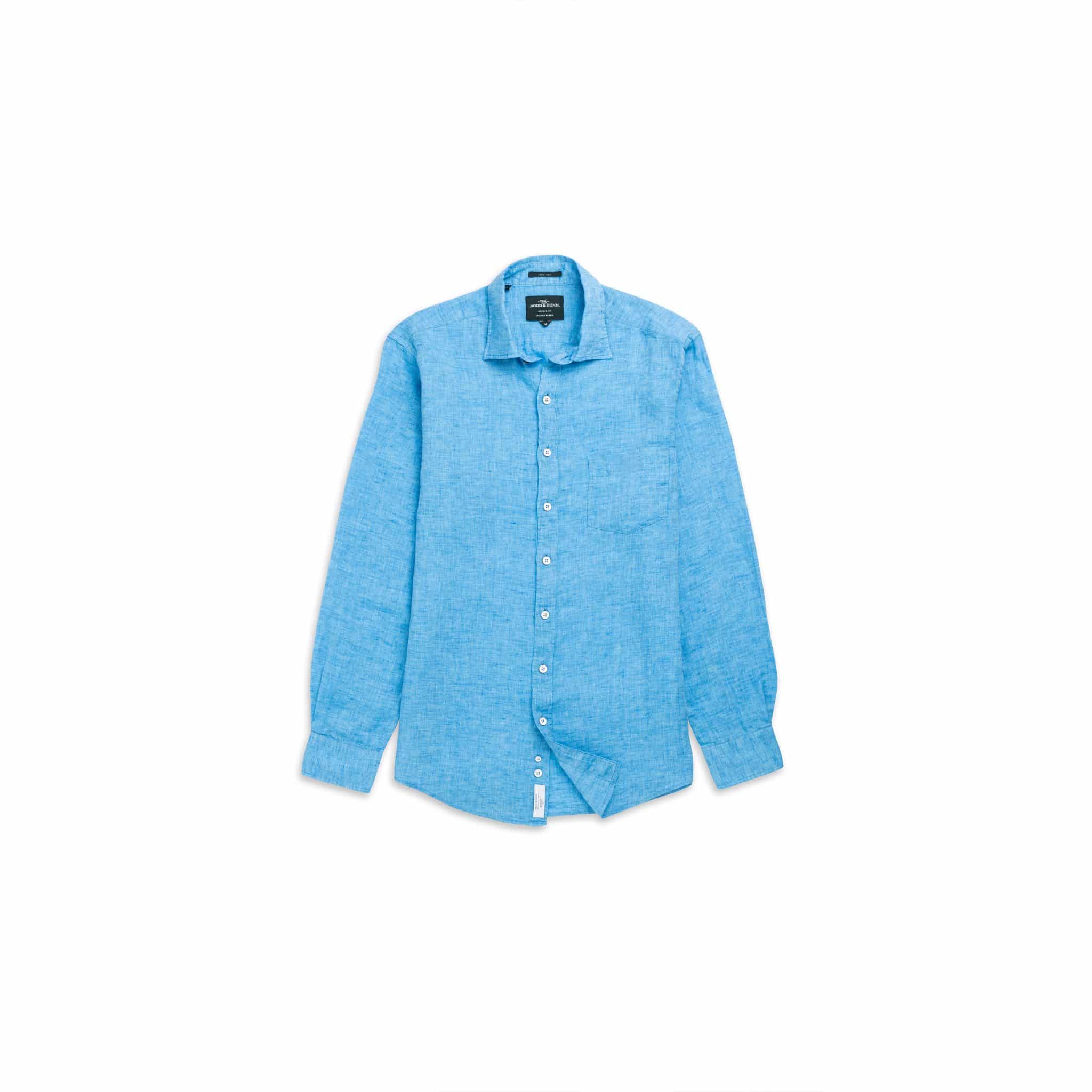 A light blue, long-sleeve, button-up linen shirt is laid flat against a white background. The shirt has a collar, a chest pocket, and white buttons down the front.