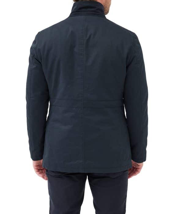 A man is shown from the back, wearing a dark navy jacket and matching pants. The background is plain white.
