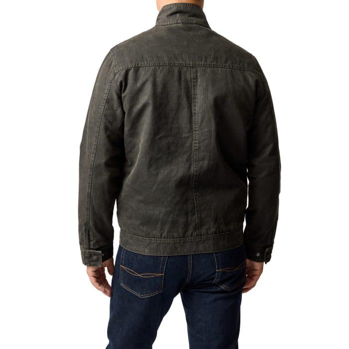 A man facing away from the camera wears a dark gray jacket and blue jeans against a plain white background.