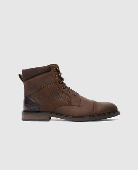 A brown leather lace-up boot with a textured side panel, dark brown heel, black outsole, and a small animal logo on the heel, displayed on a light gray background.