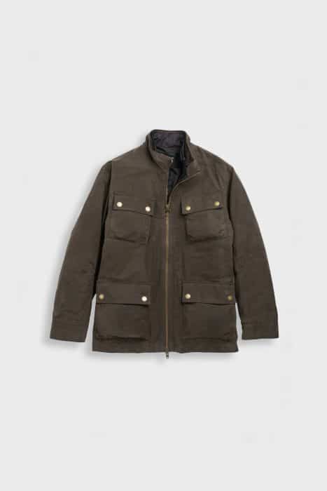Olive green field jacket with a front zipper, high collar, and four flap pockets with snap buttons on the front, laid flat on a plain light gray background.