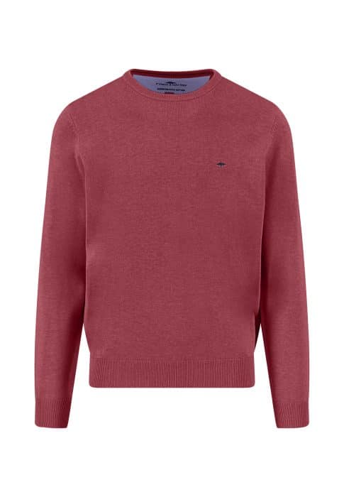 A plain, long-sleeved, crew neck sweater in a muted red color with a small, dark embroidered logo on the left chest. The sweater has ribbed cuffs, hem, and neckline.