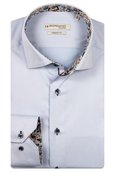 A light blue long-sleeve dress shirt with a modern fit, folded neatly. The inner collar and cuffs feature a floral pattern. The shirt has dark buttons and a Giordano Tailored label on the inside collar.