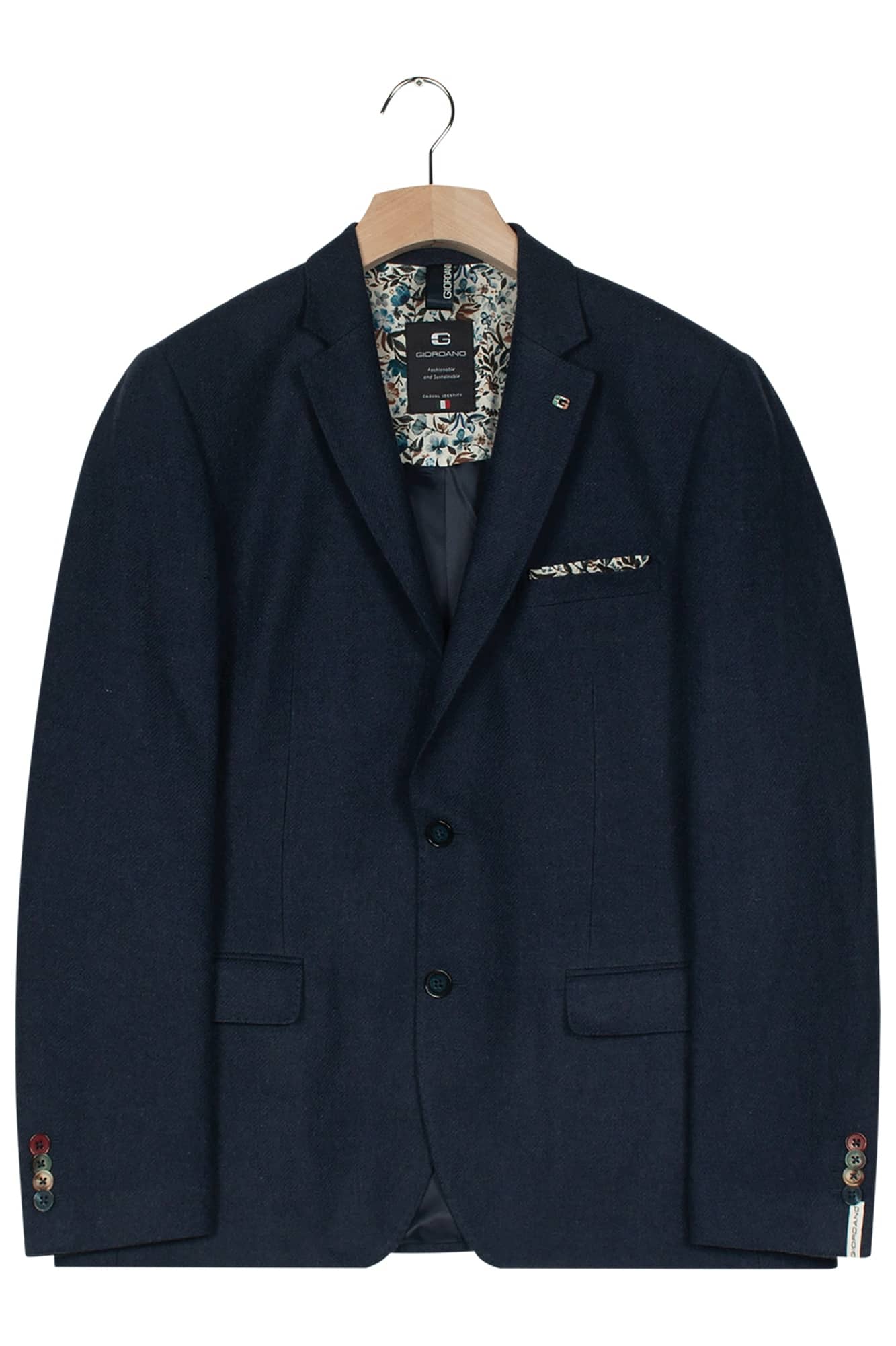 A dark navy blue blazer on a wooden hanger, featuring notch lapels, two buttons, front pockets, and a patterned pocket square in the chest pocket.