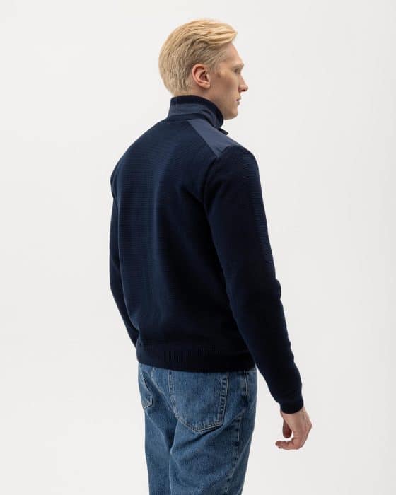 A man in a sweater.