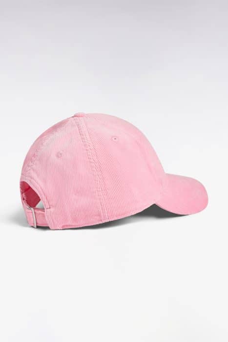 A light pink corduroy baseball cap is shown from the back on a white background, featuring a curved brim and an adjustable strap.