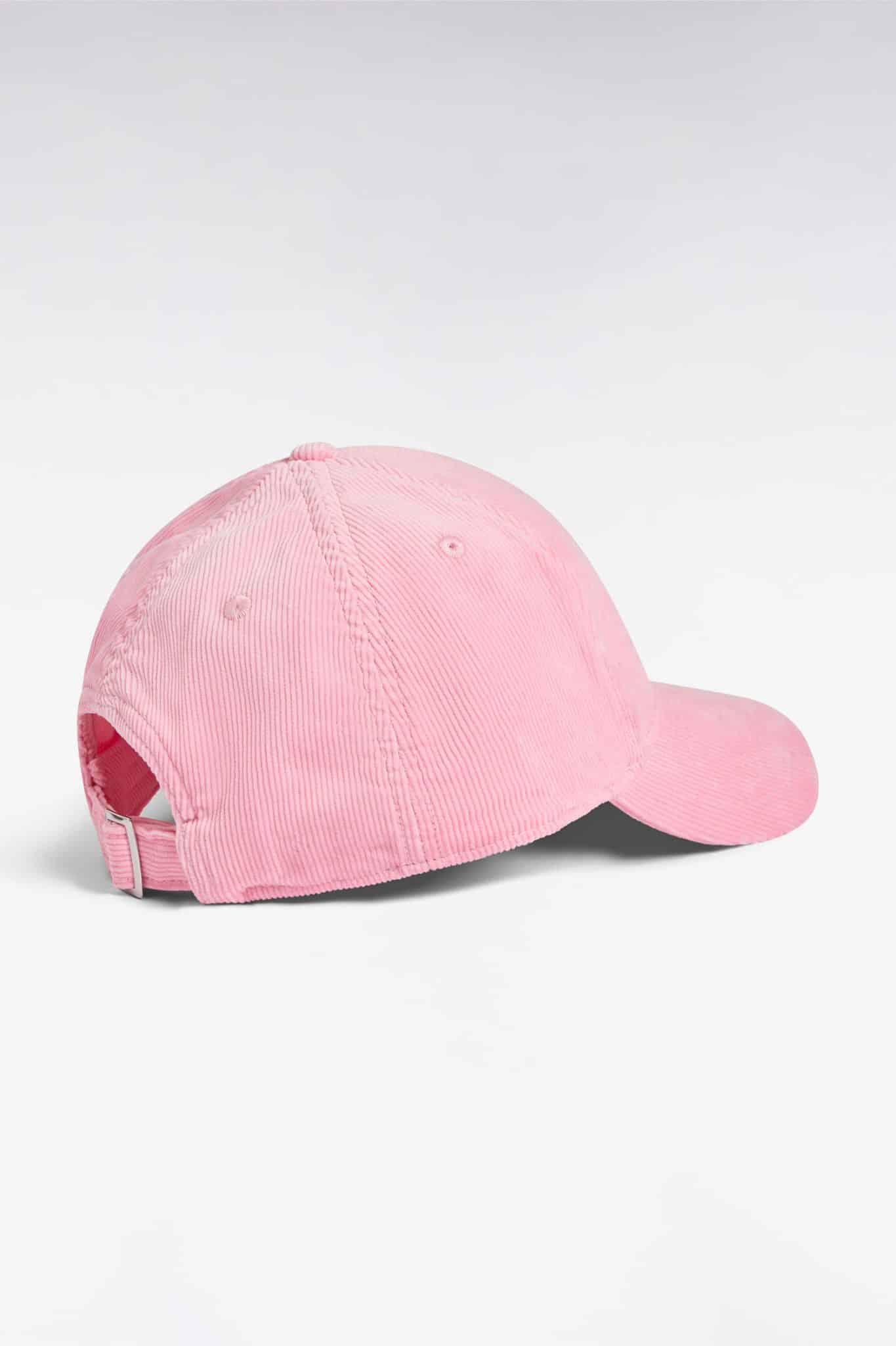 A light pink corduroy baseball cap is shown from the back on a white background, featuring a curved brim and an adjustable strap.