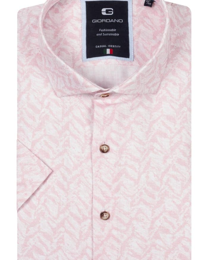 A folded light pink short-sleeve button-up shirt with a subtle geometric pattern, wooden buttons, and a Giordano brand label on the inside collar.