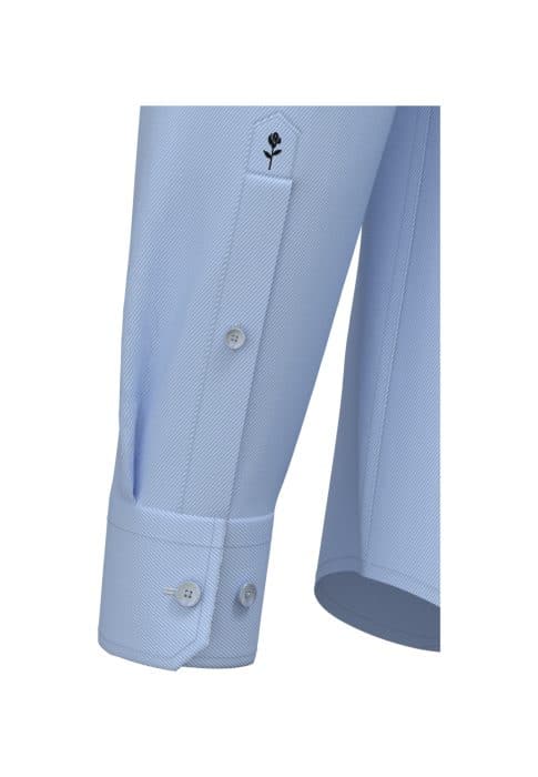 Close-up of a light blue dress shirt sleeve with a subtle textured pattern, featuring a single cuff and three white buttons. The sleeve gauntlet has a small black embroidered flower detail near the top.