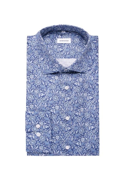 A neatly folded long-sleeve button-up shirt with a blue and white paisley pattern, displayed against a white background.