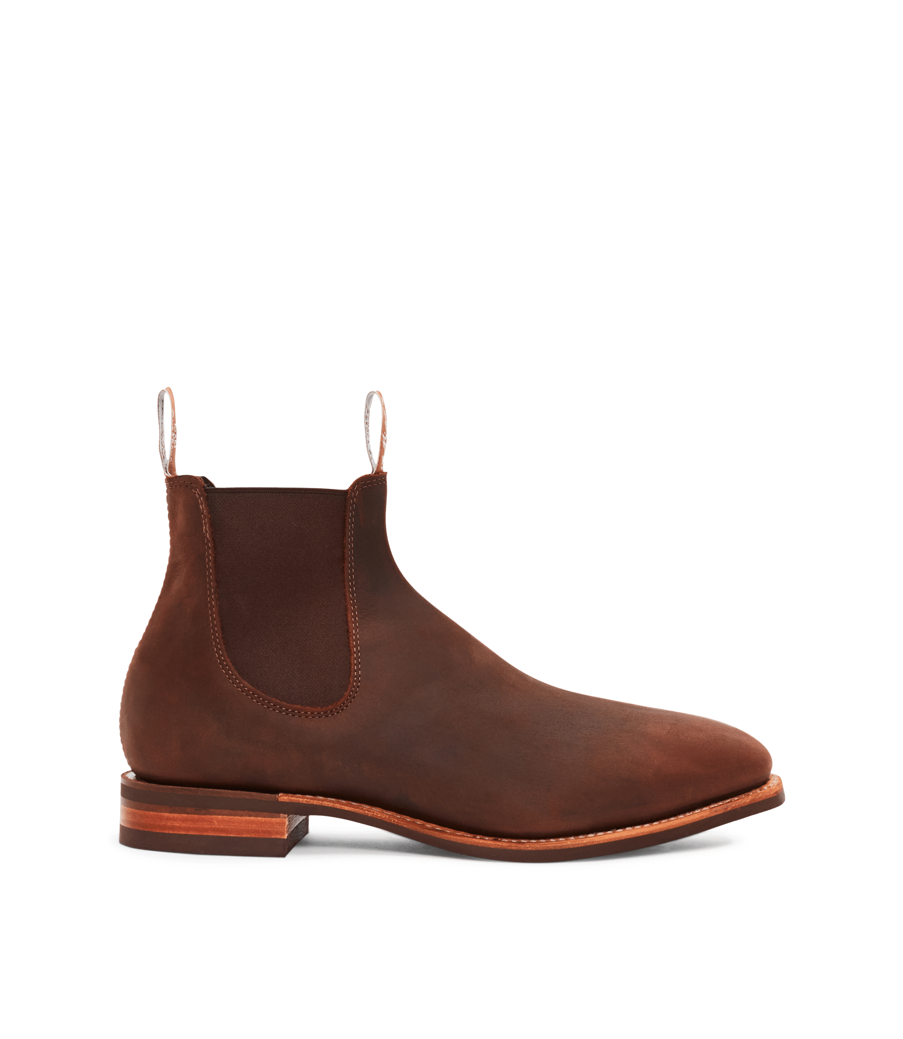 A brown leather Chelsea boot with elastic side panels, pull tabs at the front and back, and a low stacked wooden heel, displayed on a white background.