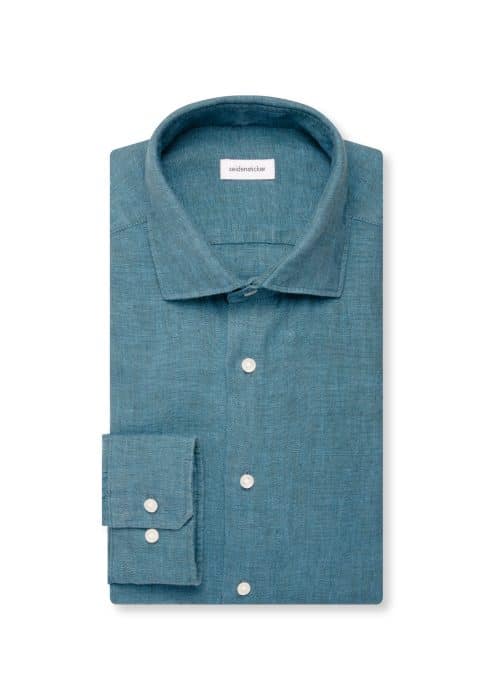 A neatly folded teal button-up shirt with a classic collar, buttoned cuffs, and white buttons, displayed on a white background.