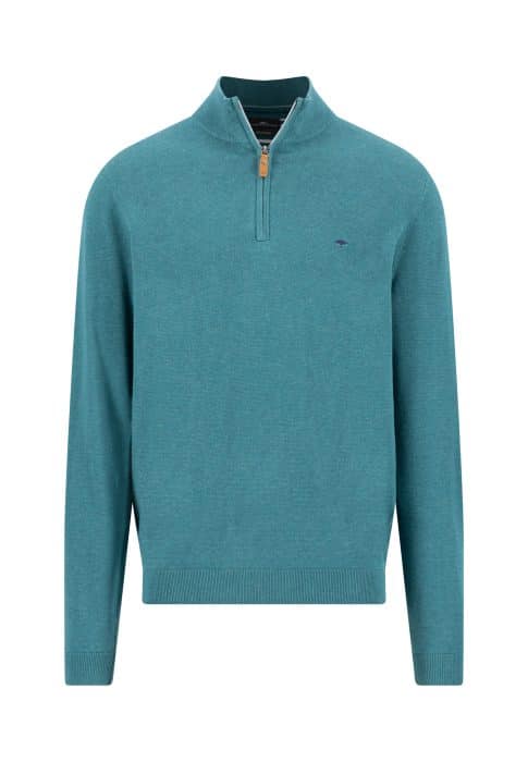 A teal long-sleeve quarter-zip jumper with ribbed cuffs and hem, featuring a small embroidered logo on the left chest and a tan zip pull.