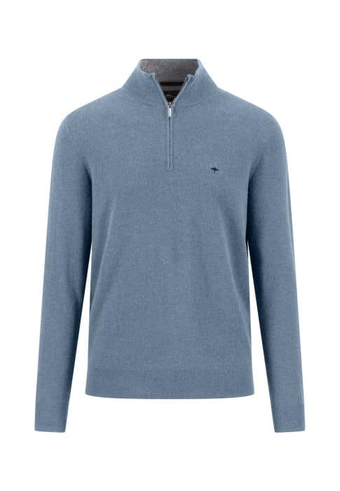 Light blue long-sleeve jumper with a quarter-zip collar, ribbed cuffs, and hem. A small, subtle logo is embroidered on the left chest. The jumper appears to be made of soft, knitted fabric.