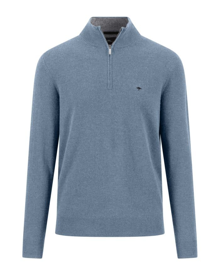 Light blue long-sleeve jumper with a quarter-zip collar, ribbed cuffs, and hem. A small, subtle logo is embroidered on the left chest. The jumper appears to be made of soft, knitted fabric.