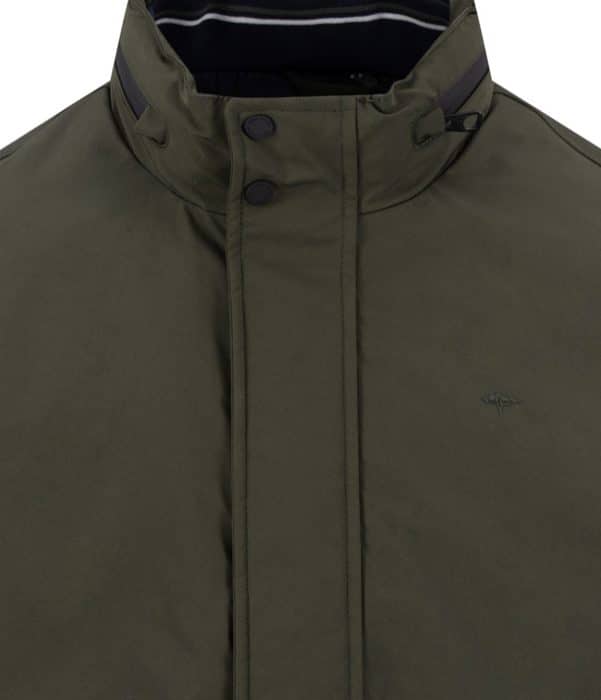 Close-up of an olive green jacket with a high collar, two black press studs, and a small embroidered logo on the chest. The jacket has subtle black and white stripes inside the collar.