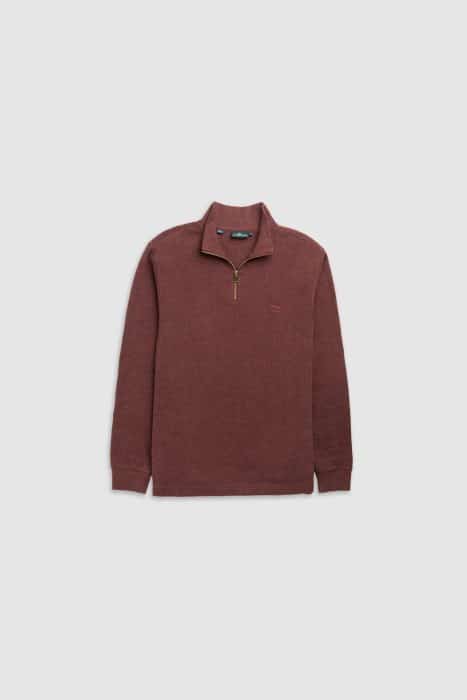 A maroon long-sleeve quarter-zip pullover jumper with a standing collar and subtle logo on the left chest, laid flat on a light background.