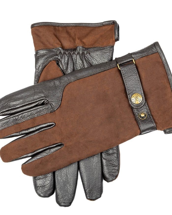 A pair of brown suede and dark leather gloves with a metal press-stud fastening on the wrist.
