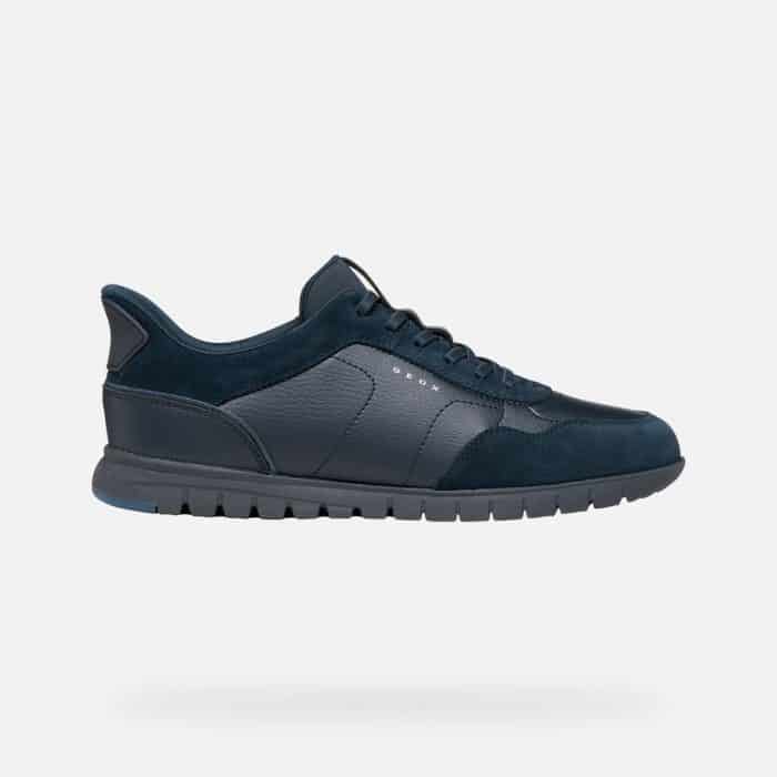 Navy blue Geox trainer with a textured leather and suede upper on a dark lugged sole.