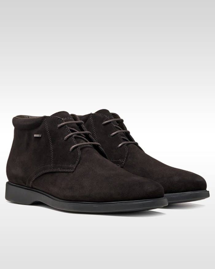 Dark brown suede chukka boots with matching laces and black rubber soles.